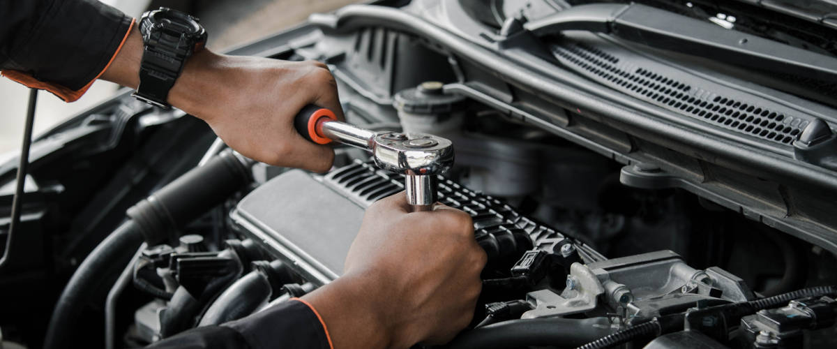 Service technician working on the car