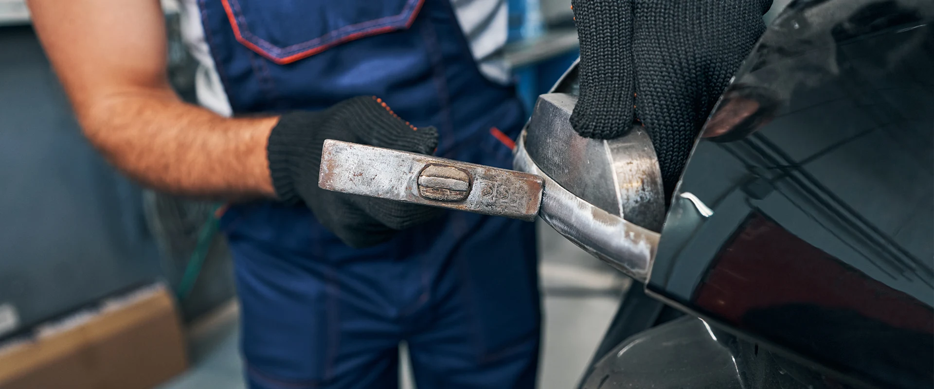5 corners Isuzu Truck technician working on vehicle